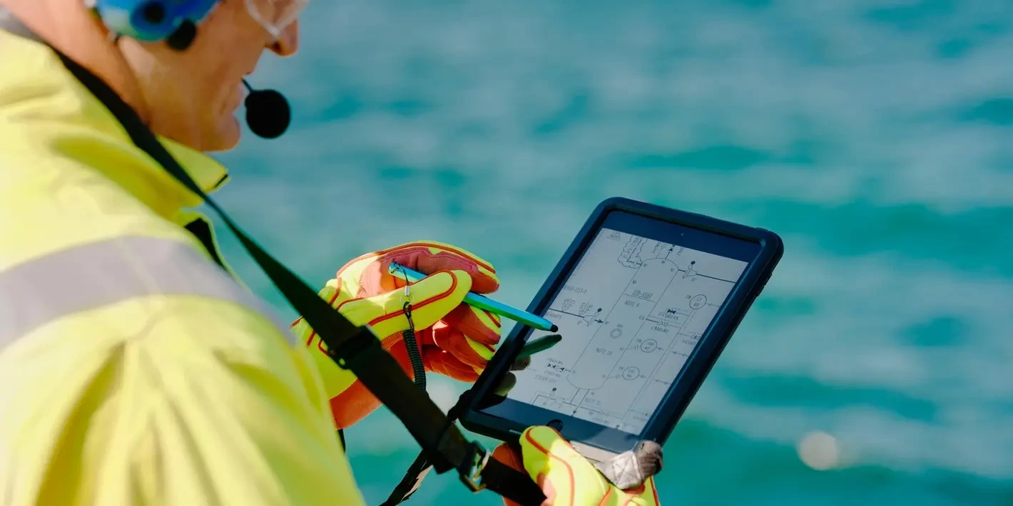 An engineer holding a tablet